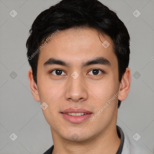 Joyful asian young-adult male with short  brown hair and brown eyes