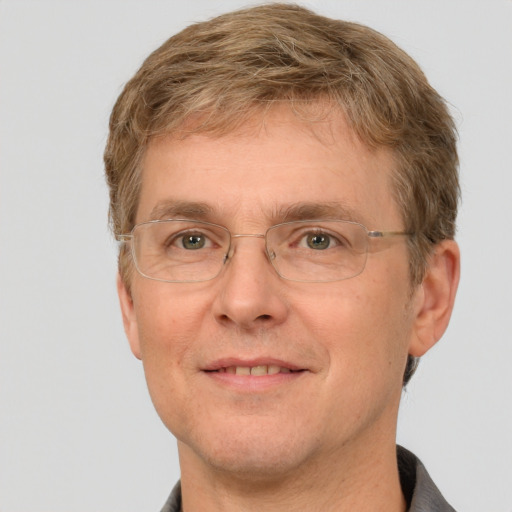 Joyful white adult male with short  brown hair and grey eyes