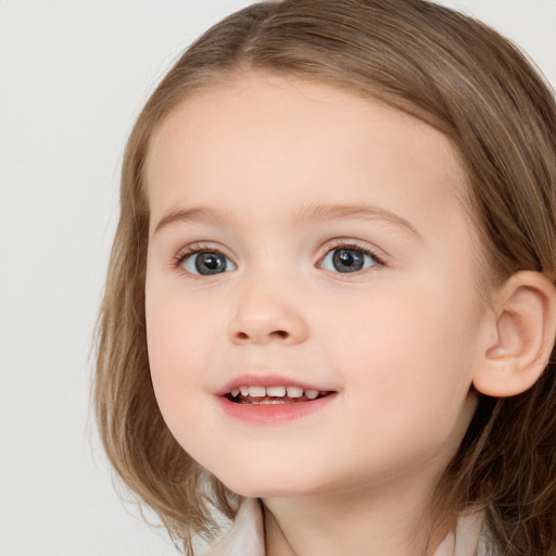 Joyful white child female with medium  brown hair and grey eyes