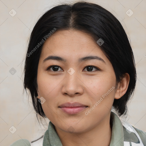 Joyful asian young-adult female with medium  black hair and brown eyes