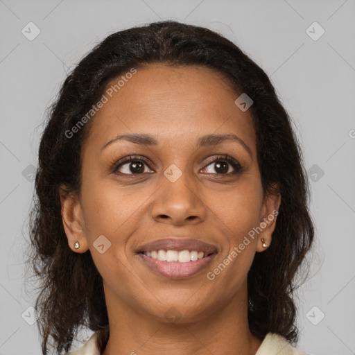 Joyful black young-adult female with medium  brown hair and brown eyes