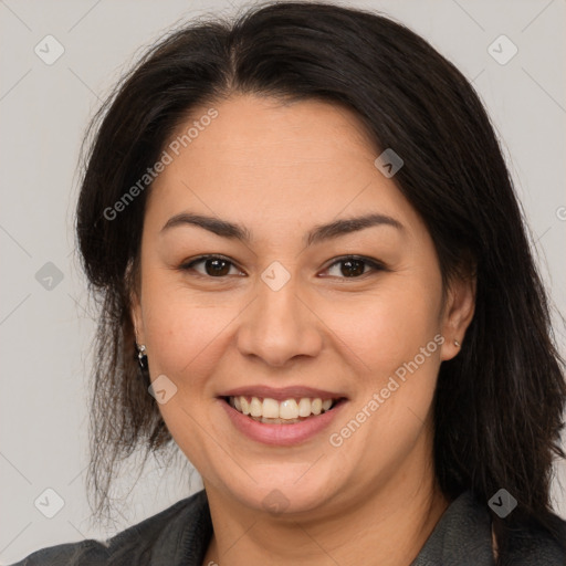 Joyful latino young-adult female with medium  brown hair and brown eyes