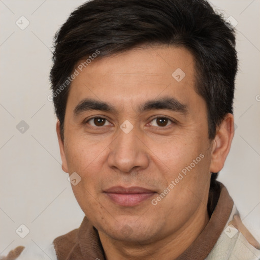 Joyful white adult male with short  brown hair and brown eyes