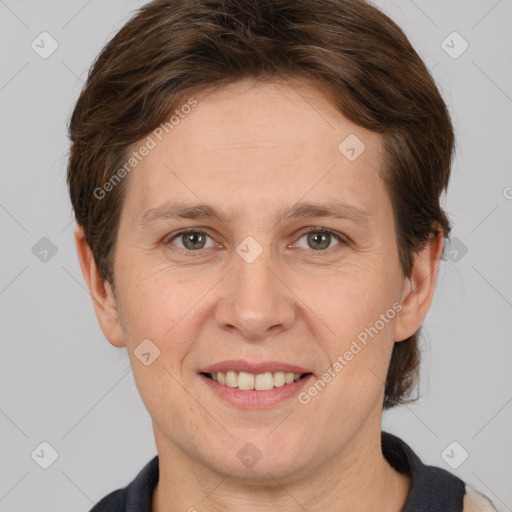 Joyful white adult female with short  brown hair and brown eyes