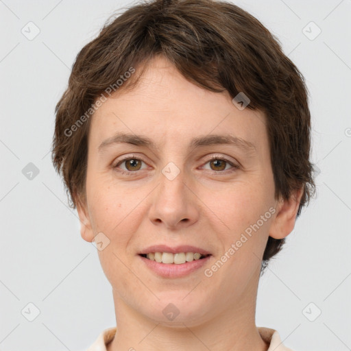 Joyful white adult female with short  brown hair and brown eyes