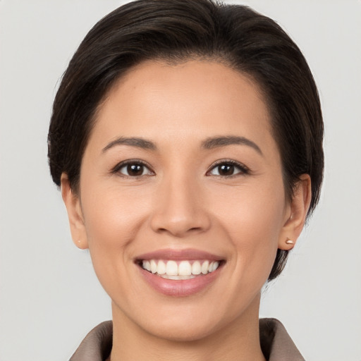 Joyful white young-adult female with medium  brown hair and brown eyes