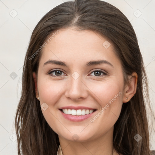 Joyful white young-adult female with long  brown hair and grey eyes