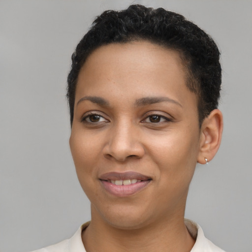 Joyful latino young-adult female with short  brown hair and brown eyes