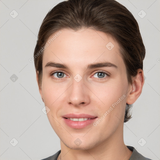 Joyful white young-adult female with short  brown hair and grey eyes