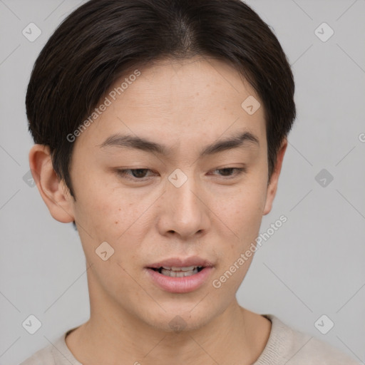 Joyful asian young-adult male with short  brown hair and brown eyes
