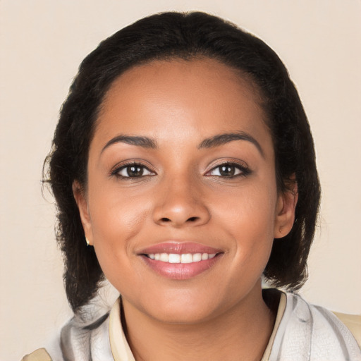 Joyful latino young-adult female with medium  black hair and brown eyes