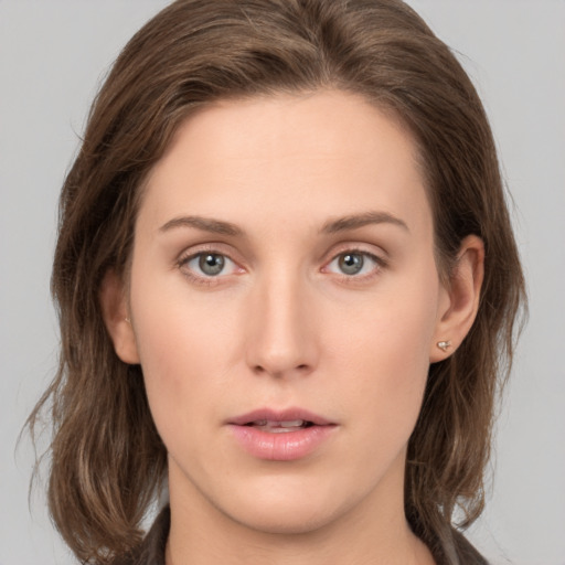 Neutral white young-adult female with medium  brown hair and green eyes