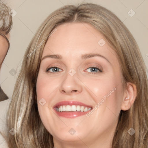 Joyful white young-adult female with medium  brown hair and blue eyes