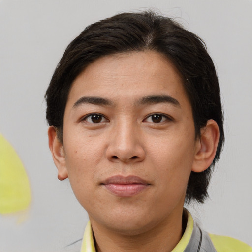 Joyful asian young-adult male with short  brown hair and brown eyes