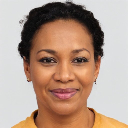 Joyful latino adult female with short  brown hair and brown eyes