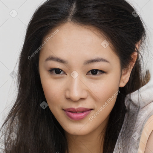 Joyful asian young-adult female with long  brown hair and brown eyes