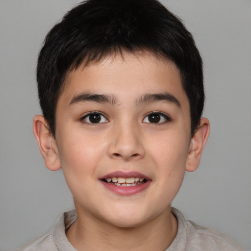 Joyful white child male with short  brown hair and brown eyes