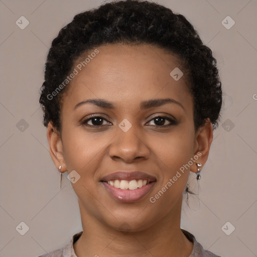 Joyful black young-adult female with short  brown hair and brown eyes