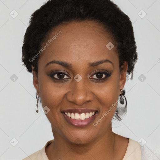 Joyful black young-adult female with short  black hair and brown eyes
