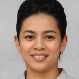 Joyful asian young-adult female with short  black hair and brown eyes