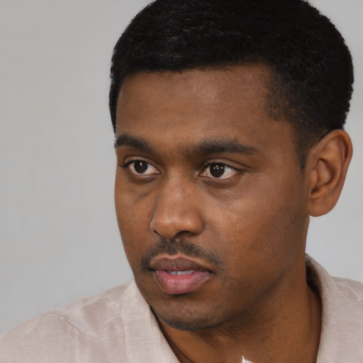 Neutral black young-adult male with short  black hair and brown eyes