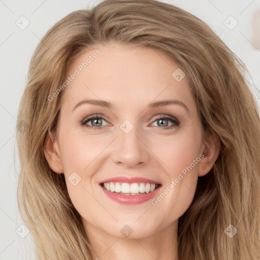 Joyful white young-adult female with long  brown hair and blue eyes