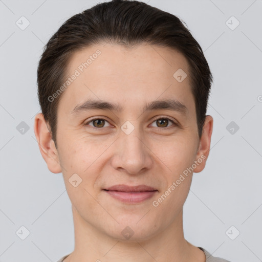 Joyful white young-adult male with short  brown hair and brown eyes