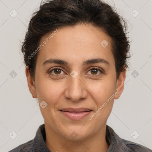 Joyful white adult female with short  brown hair and brown eyes