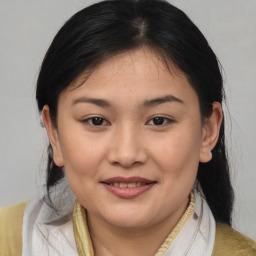 Joyful asian young-adult female with medium  brown hair and brown eyes