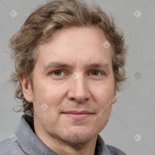 Joyful white adult male with short  brown hair and grey eyes