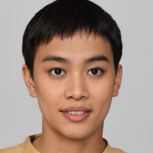 Joyful asian young-adult male with short  brown hair and brown eyes