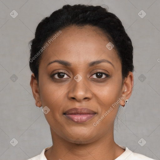 Joyful black young-adult female with short  brown hair and brown eyes