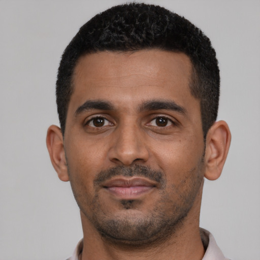 Neutral black young-adult male with short  black hair and brown eyes