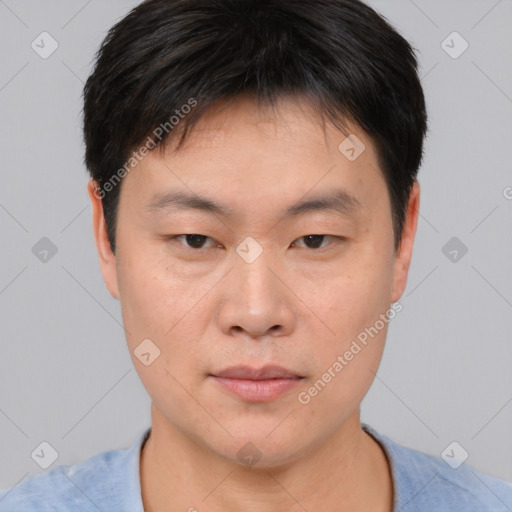 Neutral asian young-adult male with short  brown hair and brown eyes