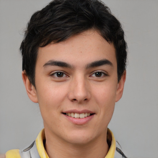 Joyful latino young-adult male with short  brown hair and brown eyes