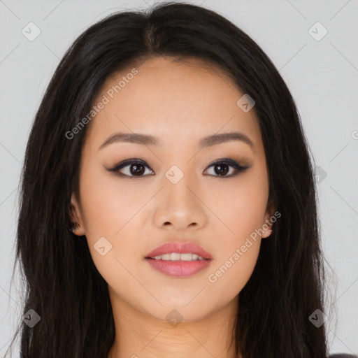 Joyful asian young-adult female with long  brown hair and brown eyes