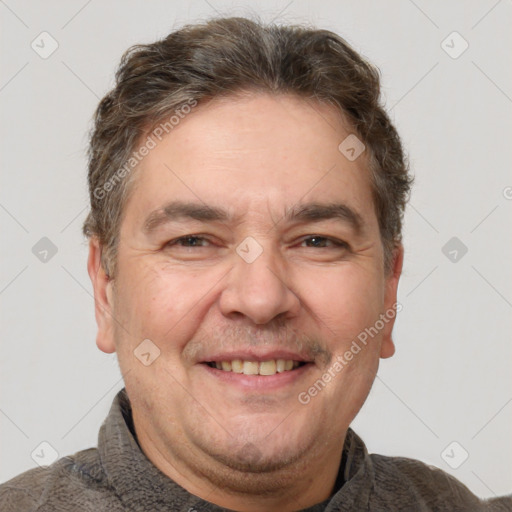 Joyful white adult male with short  brown hair and brown eyes