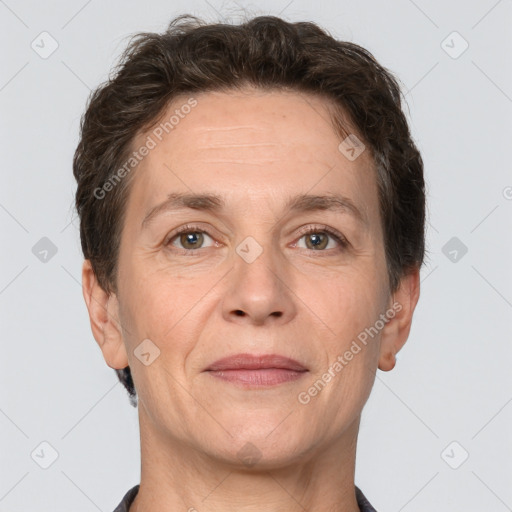 Joyful white adult female with short  brown hair and grey eyes