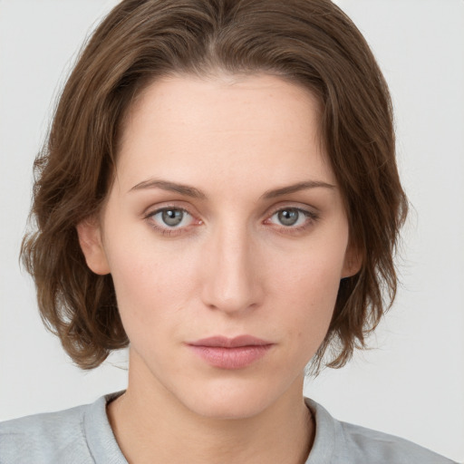 Neutral white young-adult female with medium  brown hair and grey eyes