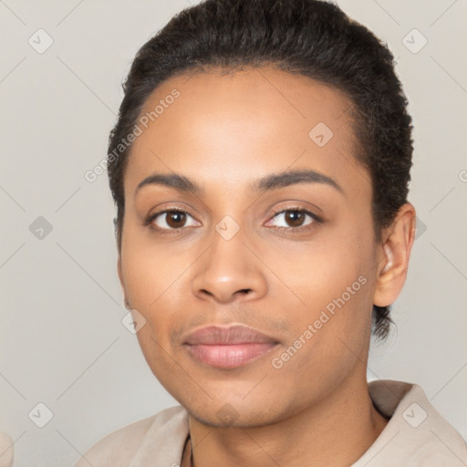 Joyful latino young-adult female with short  black hair and brown eyes