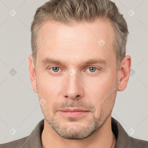 Neutral white adult male with short  brown hair and grey eyes