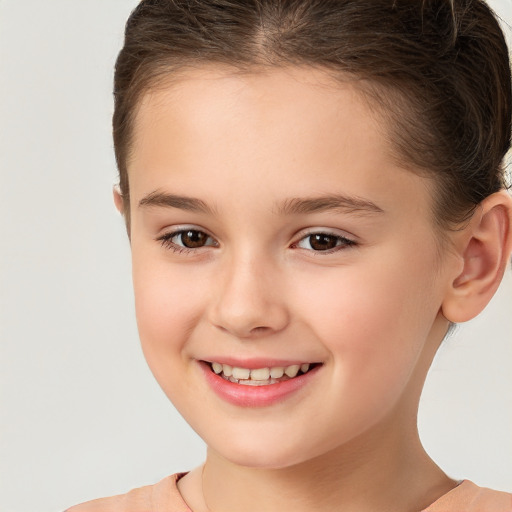 Joyful white child female with short  brown hair and brown eyes