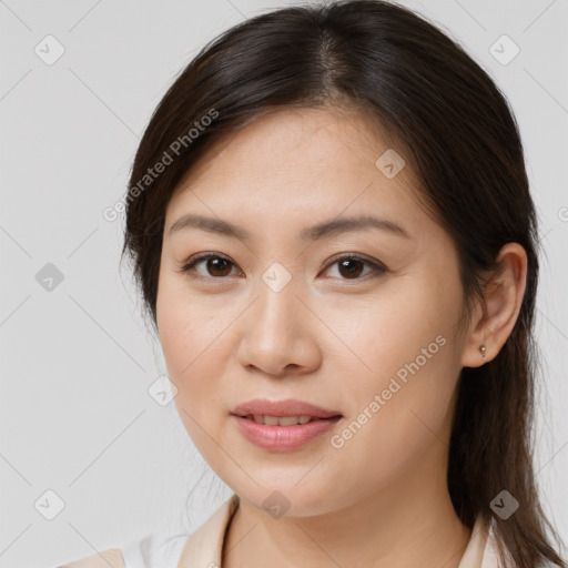 Joyful white young-adult female with medium  brown hair and brown eyes