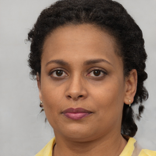 Neutral black young-adult female with short  brown hair and brown eyes
