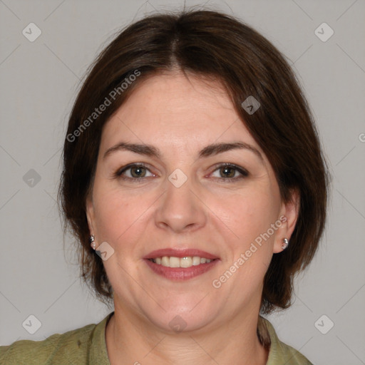 Joyful white adult female with medium  brown hair and brown eyes