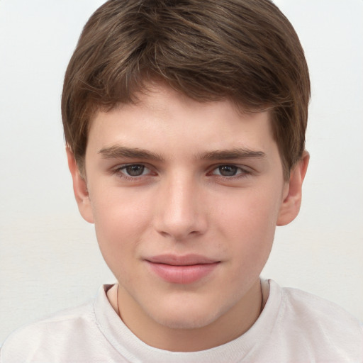 Joyful white child male with short  brown hair and brown eyes