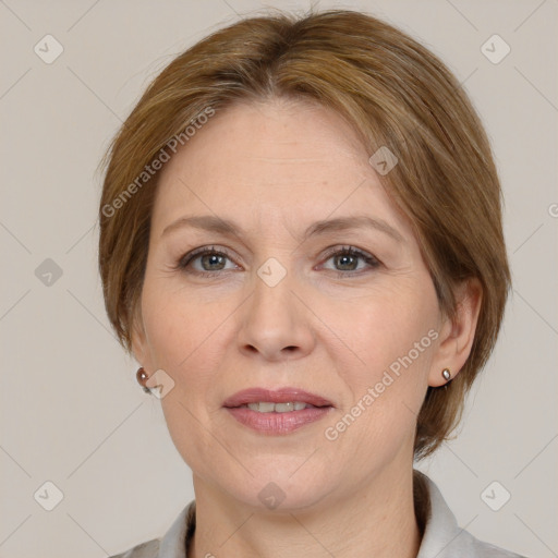 Joyful white adult female with medium  brown hair and grey eyes