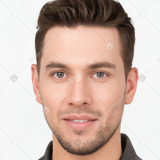 Joyful white young-adult male with short  brown hair and brown eyes