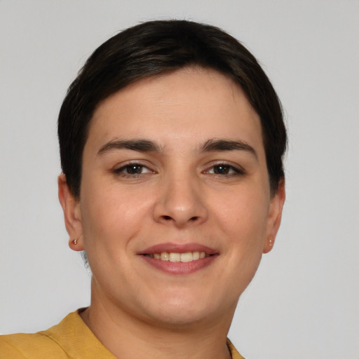 Joyful white young-adult female with short  brown hair and brown eyes