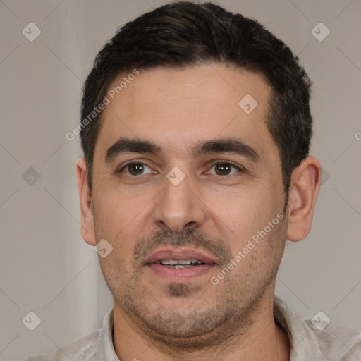 Joyful white young-adult male with short  black hair and brown eyes